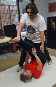 Khru Tyler Singleton practicing SomaVeda® Thai Yoga